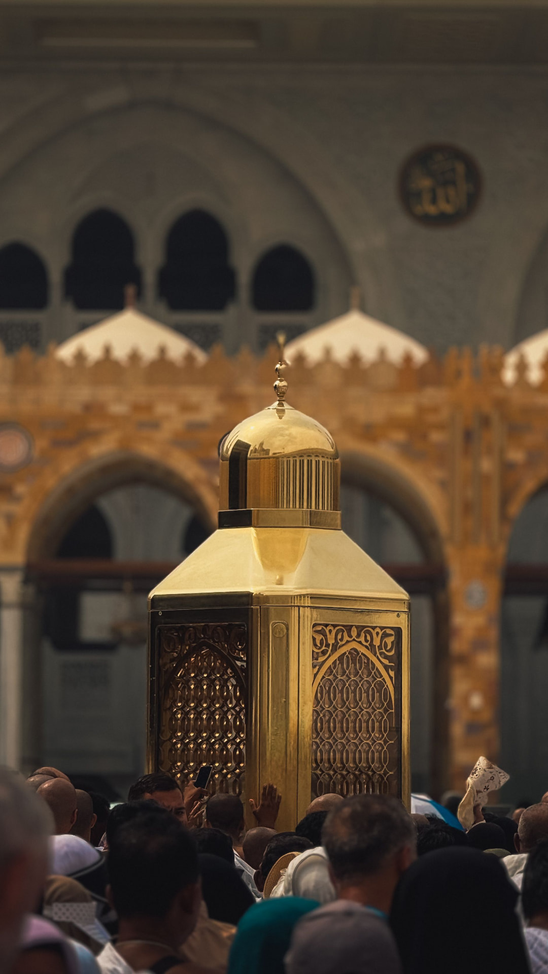 The door of the Ka'bah with the golden dome of Maqam Ibrahim in front of it