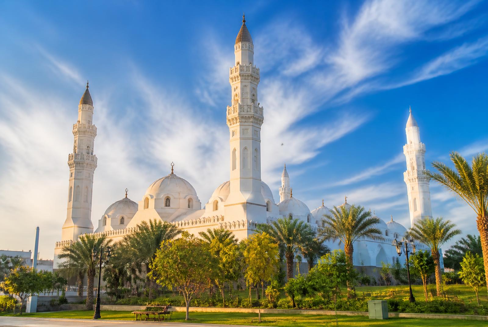 Masjid Quba in Madinah under a vivid blue sky
